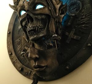 Credit: tomekmasks.ca | “The Reaper - Marzanna” - 20" x 20" Bronze, resin, paint, LEDs
